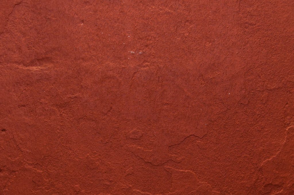 A grungy rough terracotta wall texture - perfect for background